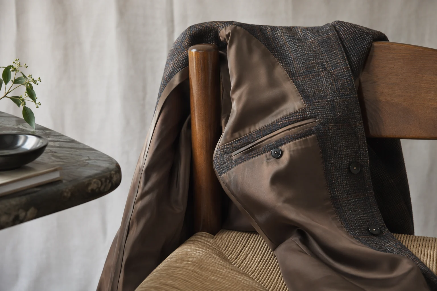 A jacket's lining, seam and buttons shown in close detail
